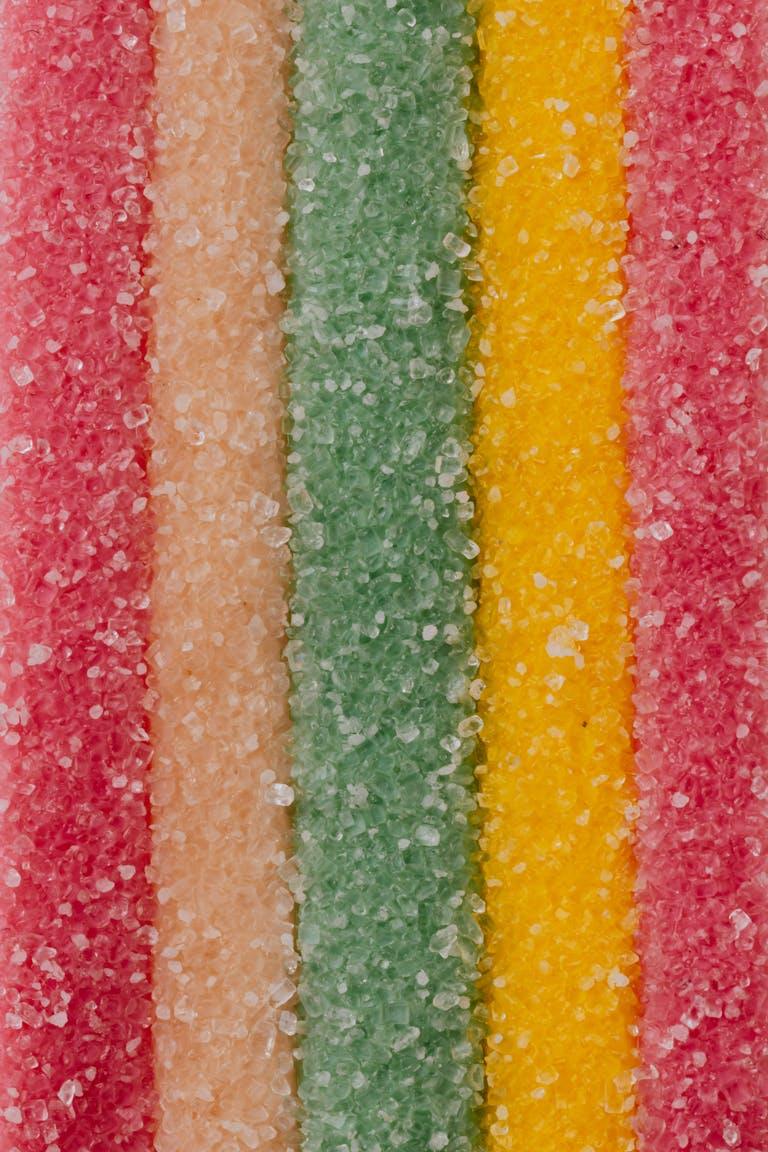 Close-up of vibrant striped sugar-coated candy stripes.